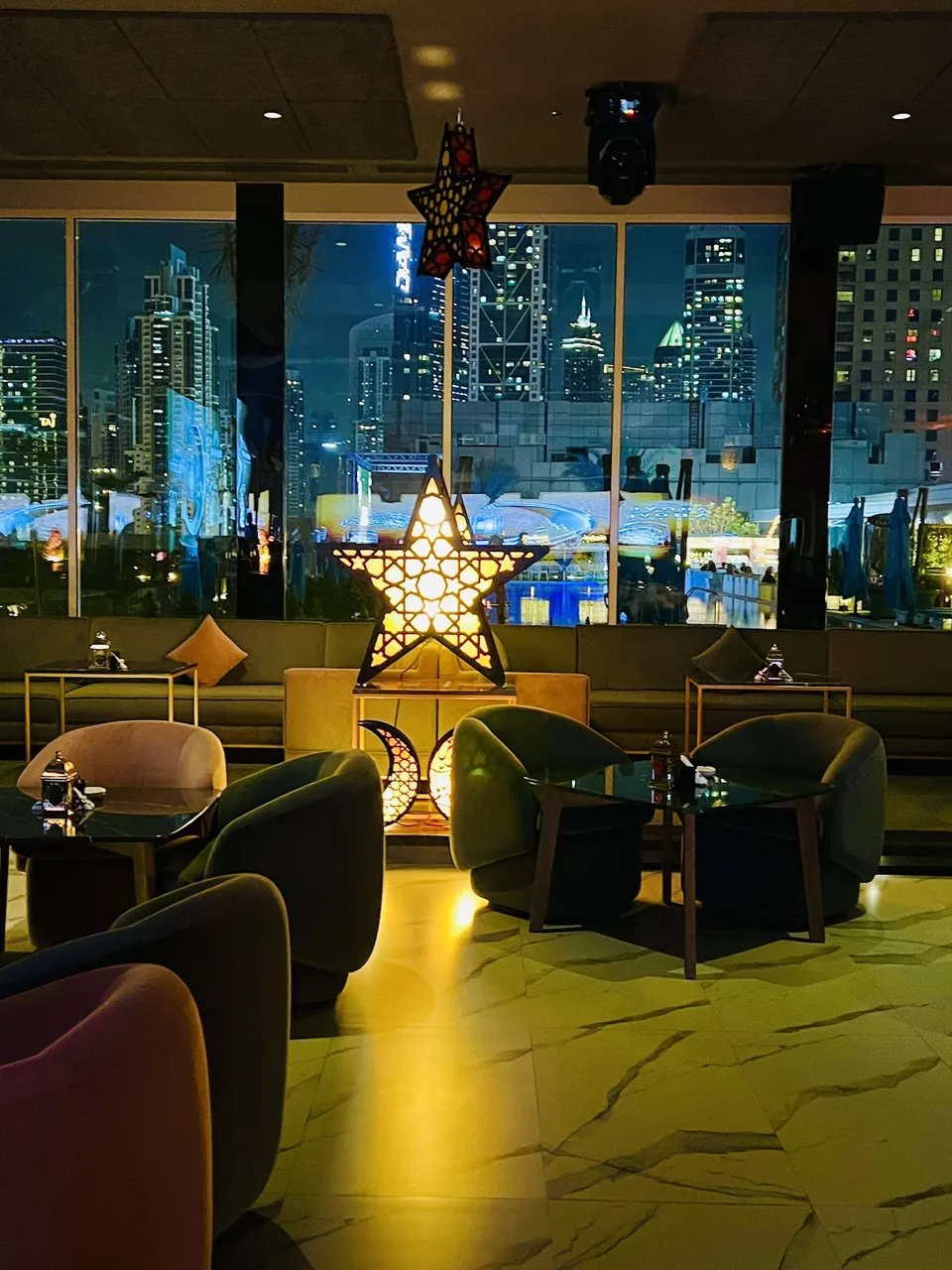 Indoor lounge seating at Above Rooftop Lounge overlooking Downtown Dubai skyline
