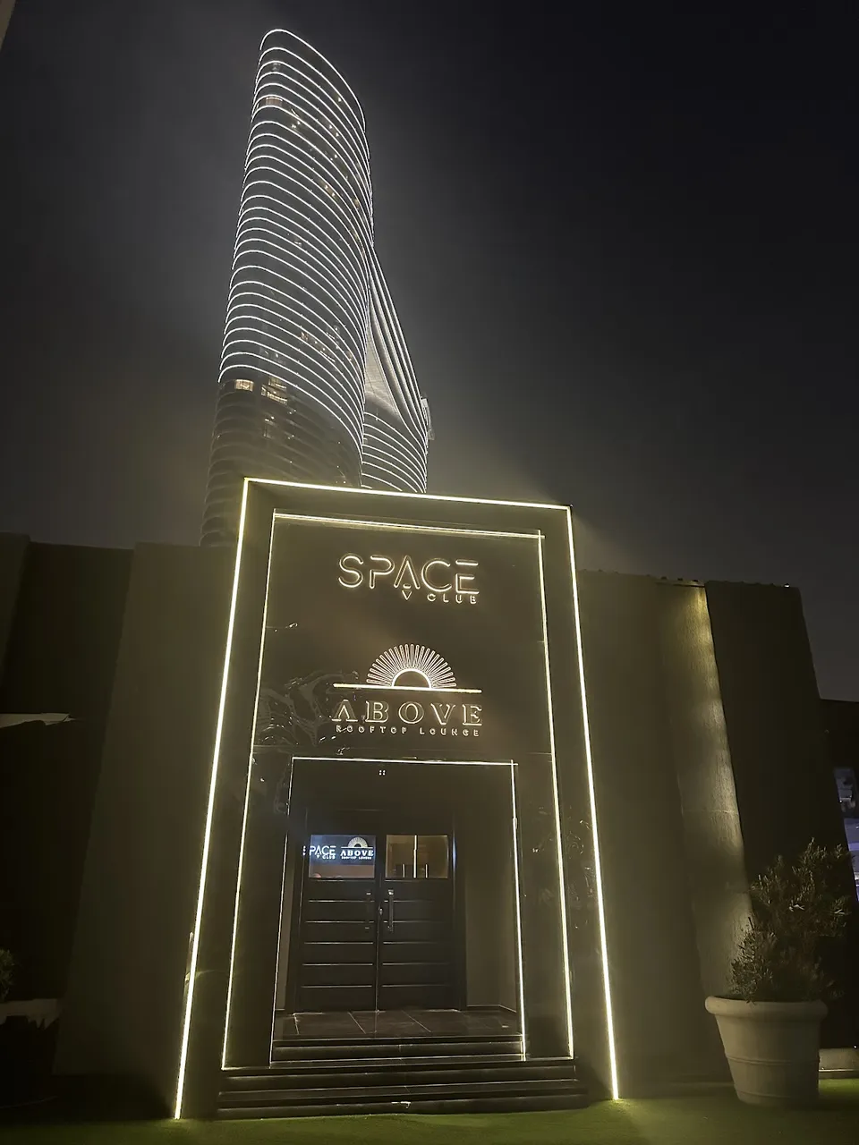 Lit exterior entrance to Above Rooftop Lounge in Downtown Dubai
